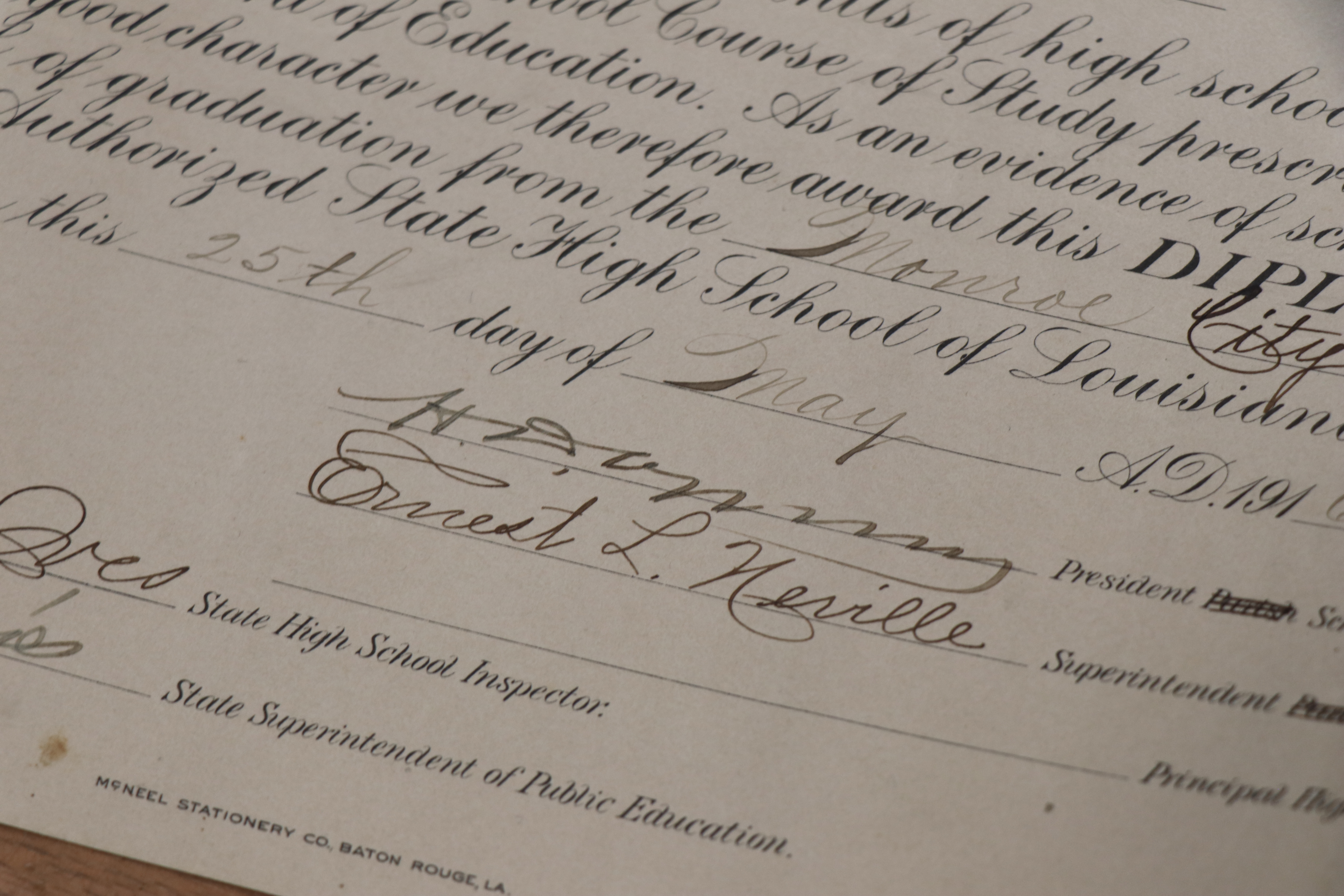 A high school diploma featuring Ernest L. Neville&#039;s signature