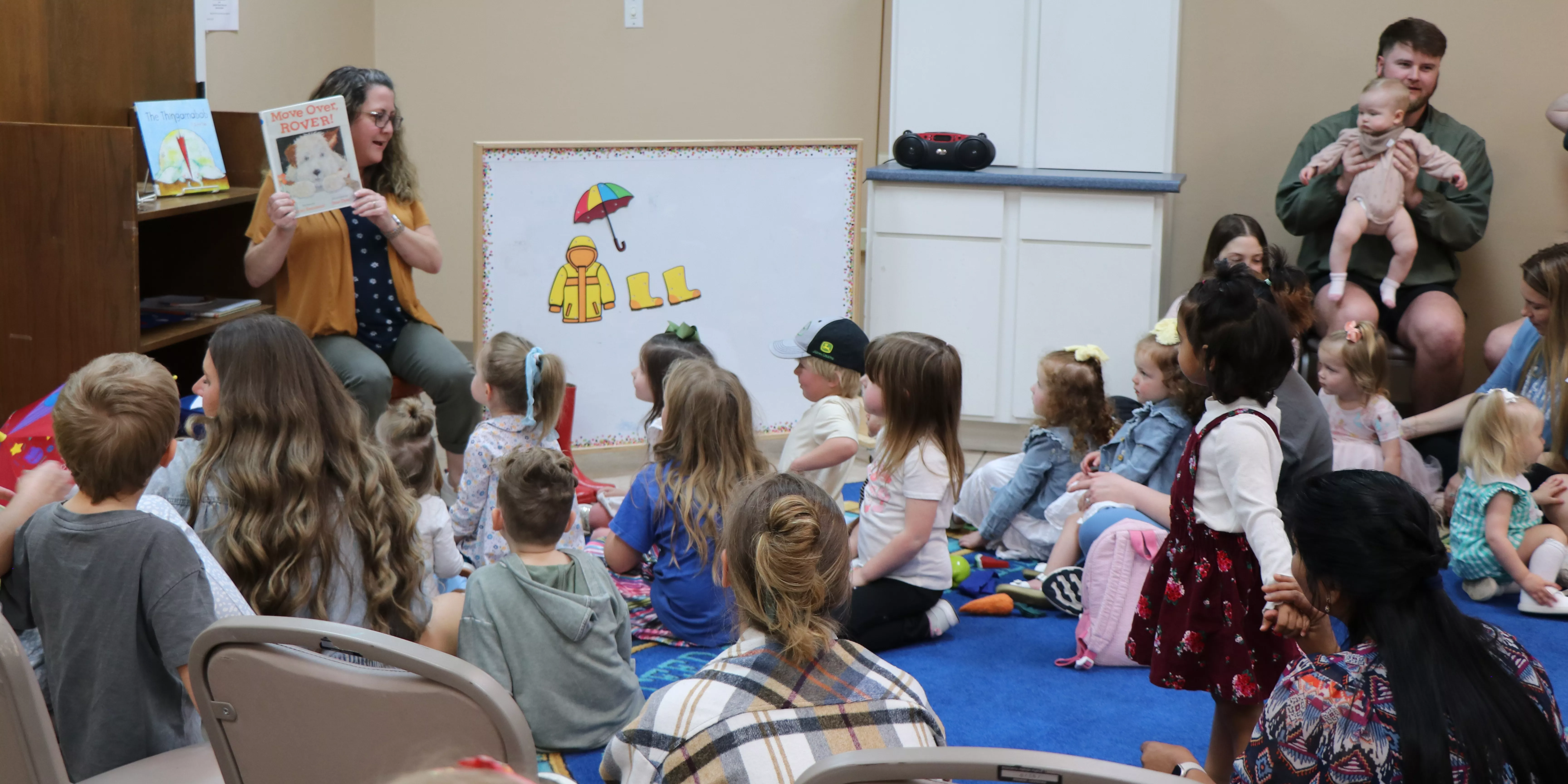 Librarian reading to kids for story time